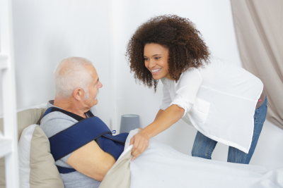 caregiver taking care of senior man